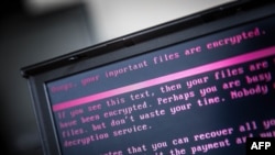 A laptop displays a message after being infected by ransomware as part of a worldwide cyberattack on June 27, 2017 in Geldrop, Netherlands.