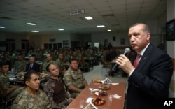 Turkey's President Recep Tayyip Erdogan addresses army officers after an "Iftar" meal during the fasting month of Ramadan in Mardin, Turkey, June 14, 2016.