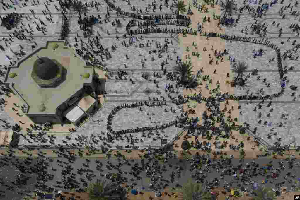 In this aerial photo, pilgrims from the Mouride Brotherhood arrive at the Grand Mosque of Touba during the celebrations of the Grand Magal of Touba, in Senegal, Oct. 6, 2020.