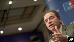 UMP right wing party general secretary Jean-Francois Cope gives a press conference at the party headquarters in Paris on March 30, 2011.