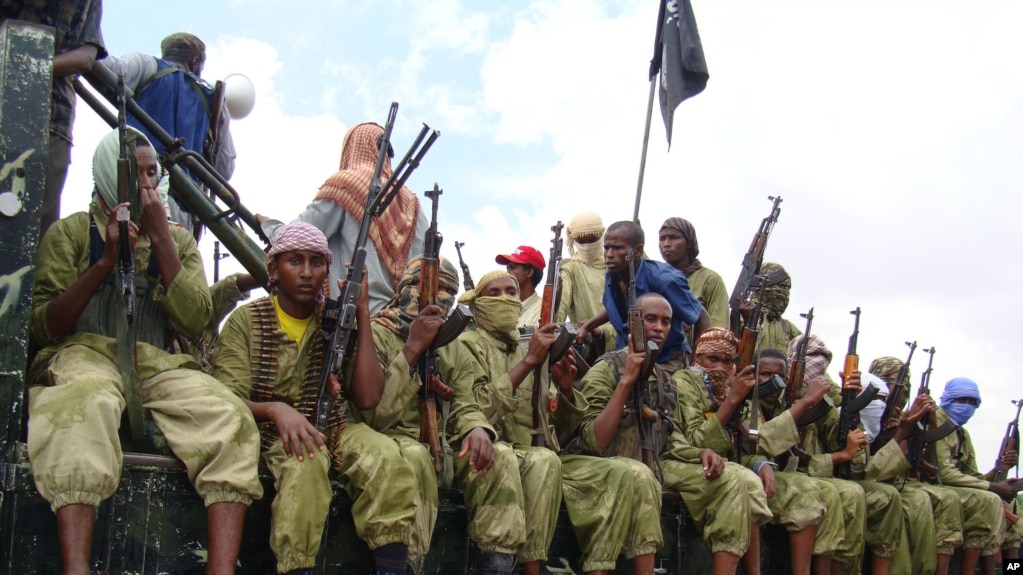 FILE - Al-Shabab fighters sit on a truck as they patrol in Mogadishu, Somalia,Oct. 30, 2009.