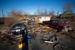 Cars sit destroyed after a tornado ripped through Dawson Springs, Kentucky, Dec. 12, 2021.