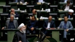 FILE - Iranian President Hassan Rouhani speaks during parliament's open session on a confidence vote for four new ministers, in Tehran, Oct. 27, 2018. 
