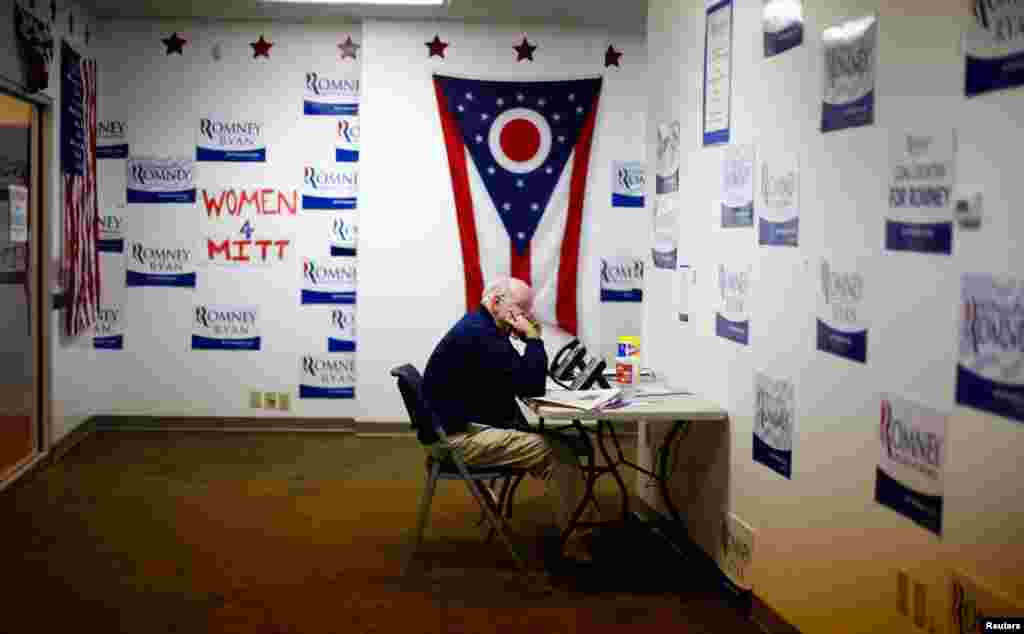 A volunteer speaks on the phone at Ohio's campaign headquarters for Mitt Romney, October 30, 2012.