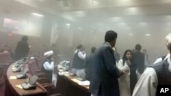 A photo taken by Afghan member of parliament Naqibullah Faiq shows lawmakers leaving the main hall after a suicide attack in front of Parliament, during clashes with Taliban fighters in Kabul, June 22, 2015.