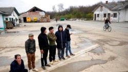 Vietnamese workers who are helping construct the first Chinese car tire factory in Europe stand in front of a barrack near the northern Serbian town of Zrenjanin, 50 kilometers north of Belgrade, Nov. 18, 2021.
