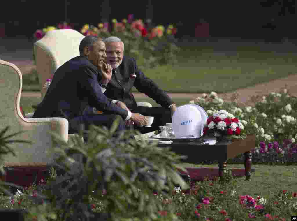 President Barack Obama and Indian Prime Minister Narendra Modi have coffee and tea in the gardens of the Hyderabad House in, New Delhi, India, Sunday, Jan. 25, 2015. 