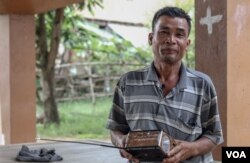 Yort Kean, a 53-year-old rice farmer in a remote village of Cambodia's Prey Veng province, said he had trouble hearing VOA news broadcast via radio, over the past year. (Sun Narin/VOA Khmer)