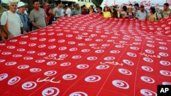 People demonstrate against Tunisia's Islamist-led government, Constituent Assembly headquarters in Tunis, Sept. 7, 2013.