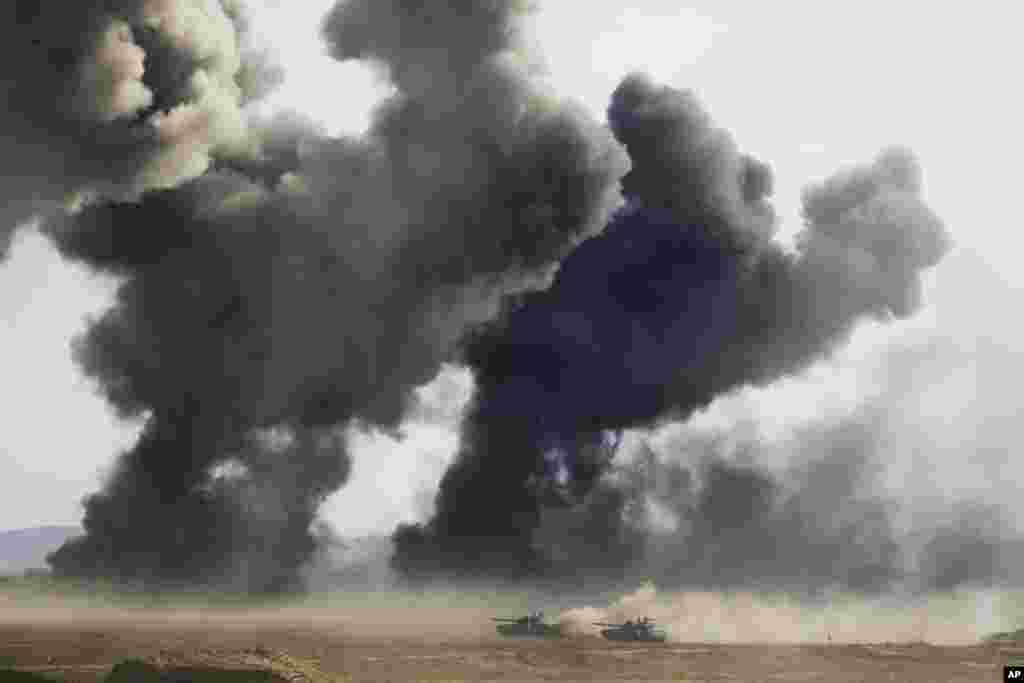 Russian army tanks during military drills at the Black Sea coast, Crimea. The drills which began across southern Russia and Crimea earlier this week and involve over 120,000 troops are some of the largest exercises Russia has held for years.