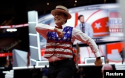 FILE - Late Show host Stephen Colbert records a skit on the floor of the Republican National Convention in Cleveland, Ohio, July 17, 2016. Colbert is known to use his show to regularly roast President Donald Trump and members of his administration.