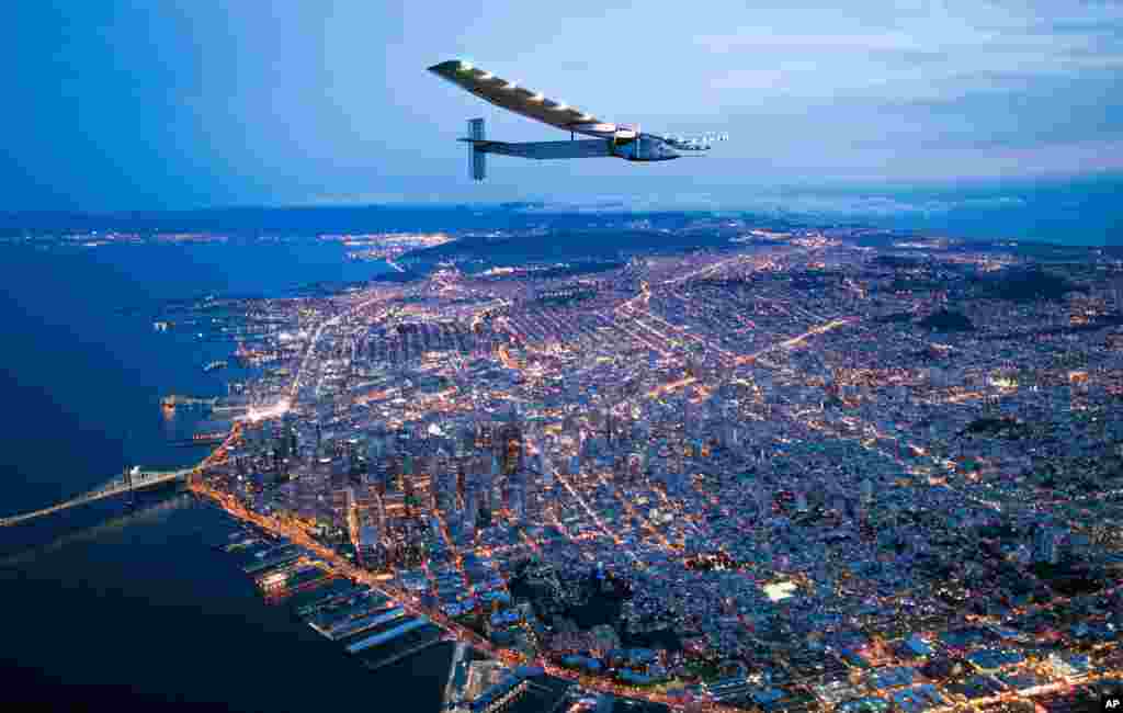 Solar Impulse 2 flies over San Francisco, April 23, 2016. The solar-powered airplane, which is attempting to circumnavigate the globe to promote clean energy and the spirit of innovation, arrived from Hawaii after a three-day journey across the Pacific Ocean.