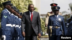 FILE - Kenya's President Uhuru Kenyatta inspects a guard of honor before the annual State of the Nation address at the Parliament Buildings in Nairobi, March 31, 2016. 