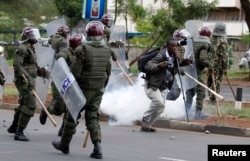 FILE - Kenyan police disperse a rally by university students in May 2014 in Nairobi.