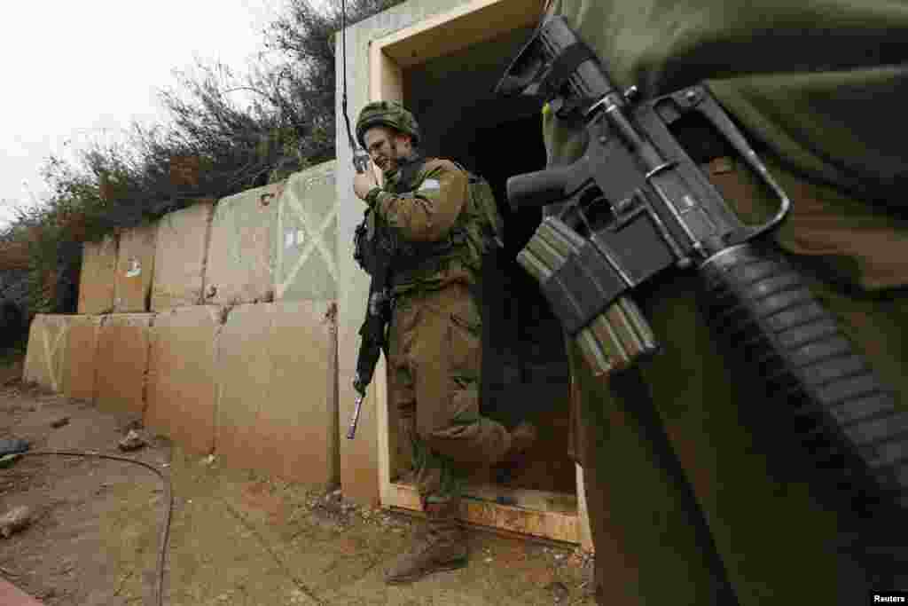 An Israeli soldier walks out of a military bunker on the Israel-Lebanon border near the northern town of Metula, Israel, Dec. 29, 2013.&nbsp;