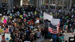 Thousands gather at Denver's City Center Park for a rally in support of the Muslim community and to protest President Donald Trump's executive order to temporarily ban some refugees from seven mostly Muslim countries, in Denver, Feb. 4, 2017.