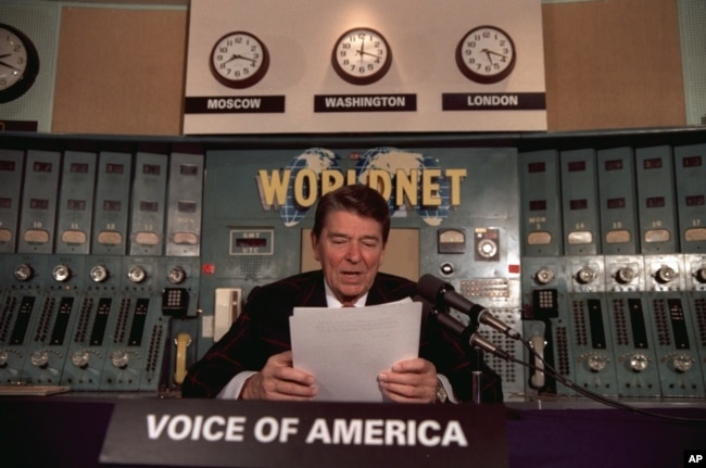 FILE - President Ronald Reagan gives his weekly radio address, on Saturday, November 9, 1985, at the Voice of America studio in Washington. (AP Photo)