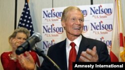 U.S. Sen. Bill Nelson, D-Fla. thanks supporters at a re-election party in Orlando, Florida, Tuesday, Nov. 6, 2012. On his left, is wife Grace Nelson.