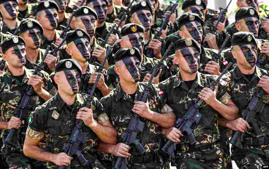 Lebanese Army commandos march in a military parade during an official ceremony commemorating the country's 73rd independence day in the capital Beirut.