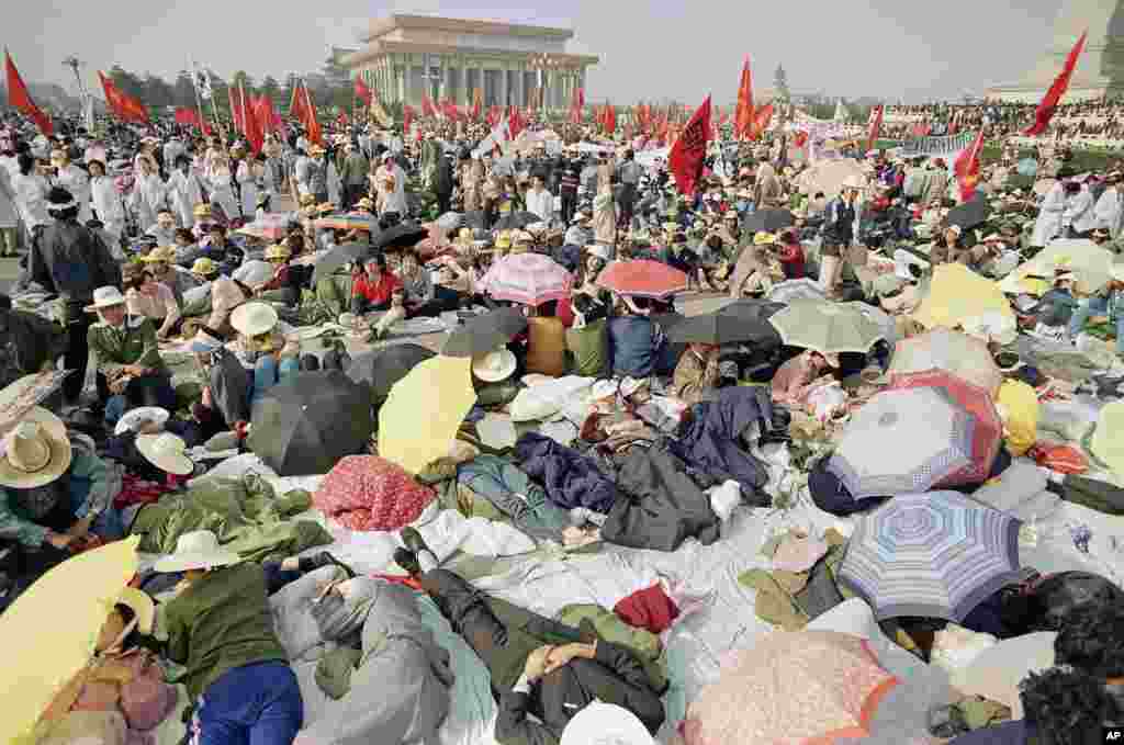 Beijing University students relax in Tiananmen Square as their hunger strike for democracy begins a fourth day, May 16, 1989.