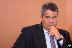 FILE - German Vice Chancellor and Economy Minister Sigmar Gabriel arrives for the weekly cabinet meeting of the German government at the chancellery in Berlin, June 22, 2016.