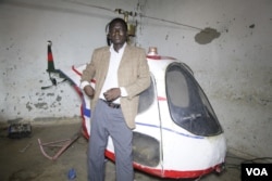 Radio repairman Felix Kambwiri is proud of the helicopter he spent four months building in Dowa, Malawi, March 13, 2016. (L. Masina/VOA)