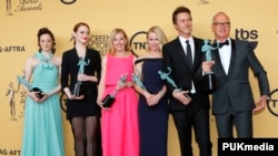The cast of "Birdman," from left, Andrea Riseborough, Emma Stone, Amy Ryan, Naomi Watts, Edward Norton and Michael Keaton were awarded for Outstanding Performance by a Cast in a Motion Picture at the Screen Actors Guild Awards in Los Angeles, Calif., Jan.
