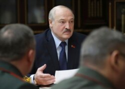 Belarusian President Alexander Lukashenko attends a meeting with military top officials in Minsk, Belarus, Jan.17, 2022.