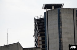 An unfinished abandoned skyscraper Torre de David is seen leaning in Caracas, Aug. 21, 2018, following a 7.3-magnitude earthquake that struck in the Venezuelan northeastern state of Sucre.