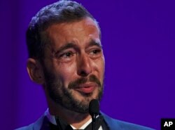 Director Xavier Legrand gets emotional after being awarded the Silver Lion for best director for "Jusqu'a la Garde" during the awards ceremony at the 74th Venice Film Festival at the Venice Lido, Italy, Sept. 9, 2017.