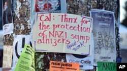 A protest sign is tacked to a pole before a speaking engagement by Ben Shapiro on the campus of the University of California Berkeley in Berkeley, Calif., Sept. 14, 2017. 