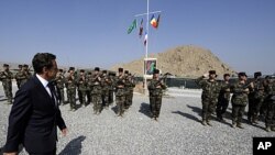 French President Nicolas Sarkozy visits French troops at the 152nd Infantry Regiment military base in Tora in the region of Surobi, Afghanistan, July 12, 2011