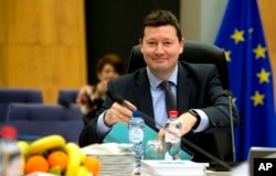 FILE - Secretary-General of the Commission Martin Selmayr waits for the start of a meeting at EU headquarters in Brussels, March 7, 2018.
