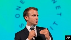 FILE - French President Emmanuel Macron speaks during the One Planet Summit in New York, Sept. 26, 2018.