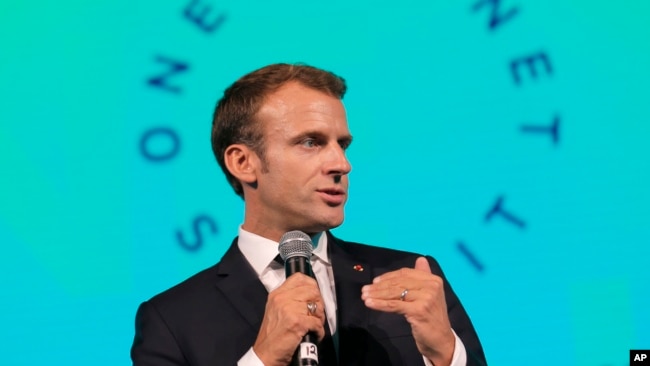 FILE - French President Emmanuel Macron speaks during the One Planet Summit in New York, Sept. 26, 2018.