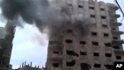ຕຶກອາຄານຕ່າງໆໃນເມືອງ Homs ທີ່ຖືກໂຈມຕີໂດຍກໍາລັງຂອງລັດຖະ ບານ