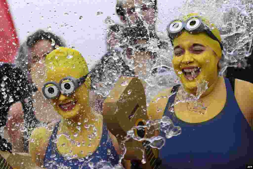 Women disguised as Minions movie characters take part in the 78th &quot;Coupe de Noel&quot; (Christmas cup) swimming race in the Lake Geneva in Geneva, Switzerland.