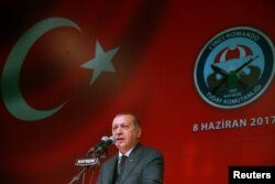 Turkish President Tayyip Erdogan delivers a speech during a fast-breaking iftar dinner at the 1. Commando Brigade in Kayseri, Turkey, June 8, 2017.