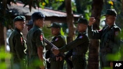 FILE - Trainees stand at attention at an army training base in Pathein, Irawaddy, Myanmar.
