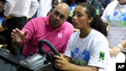 FILE - A Boys & Girls Clubs of Venice teen tests her driving skills at a UPS Road Code event on Thursday, October 24, 2019, in Los Angeles. The event was part of National Teen Driver Safety Week. (Jordan Strauss/AP Images for Boys and Girls Clubs of America)