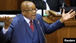 FILE – South African President Jacob Zuma addresses parliament in Cape Town, Nov. 2, 2017. Closed-door negotiations this week are aimed at persuading him to leave office.
