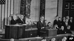 File - President Lyndon B. Johnson delivers State of the Union address to joint session of Congress, Washington, Jan. 8, 1964.