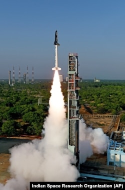 India's first indigenously made and reusable space launch vehicle is seen lifted off from the launch pad at Satish Dhawan Space Center in Sriharikota, in the southern Indian state of Andhra Pradesh, May 23, 2016.