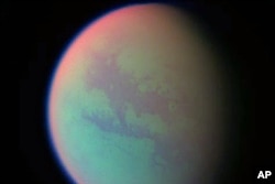 This false-color composite was created with images taken during the Cassini spacecraft's closest flyby of Titan, April 2005. (file photo)
