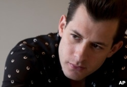 British music producer and DJ Mark Ronson speaks to journalists at a media event in Mexico City, April 17, 2015.