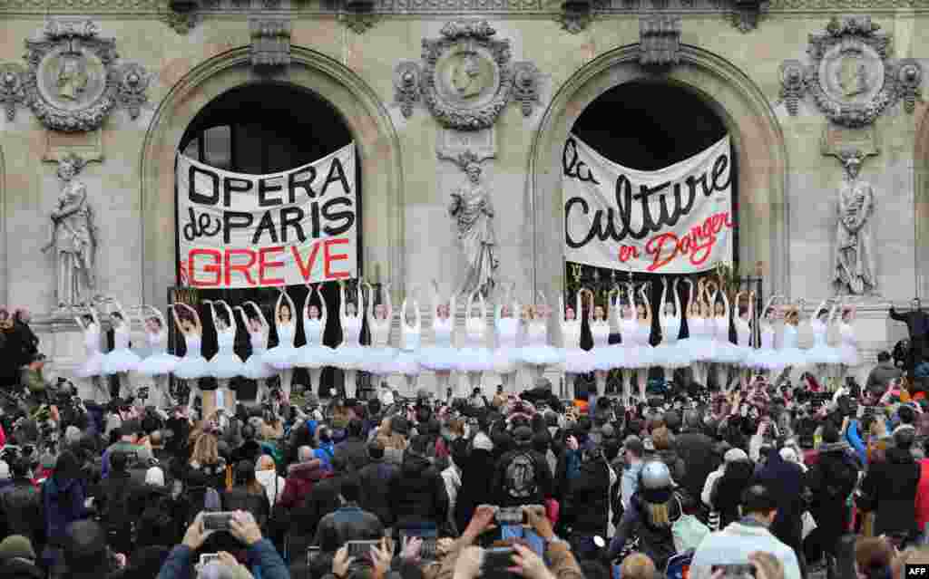 Paris Opera dancers perform in front of the Palais Garnier against the French government's plan to overhaul the country's retirement system, in Paris, France.