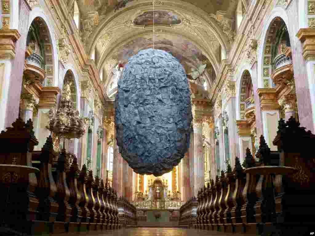 A synthetic boulder (large rock) called &quot;To be in Limbo&ldquo; hangs from the ceiling of the 20-meter-high Jesuit Church in Vienna, Austria.