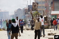 Opposition supporters clash with police in the Jacaranda grounds quarter in Nairobi, Kenya, Nov. 28, 2017.