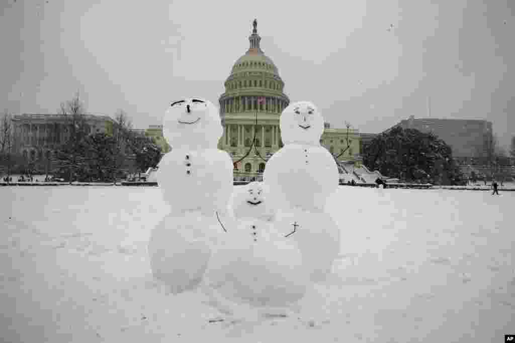 برف غافلگیرانه در شهر واشنگتن. ساخت آدم برفی ها در مقابل کنگره آمریکا.