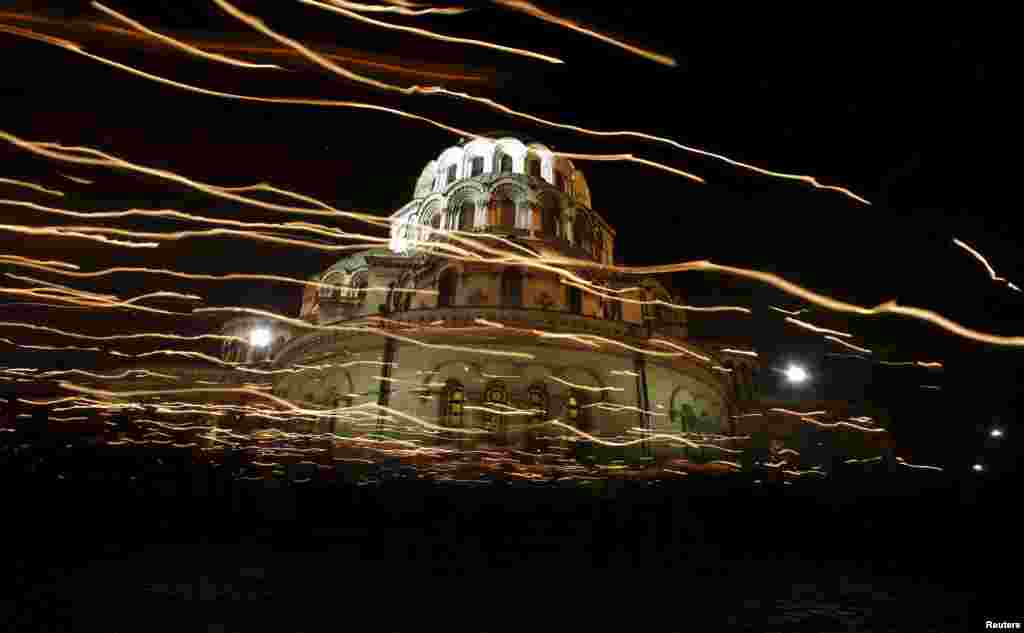 Worshippers walk with candles around the golden-domed Alexander Nevski cathedral during the Orthodox Easter service in Sofia, Bulgaria.